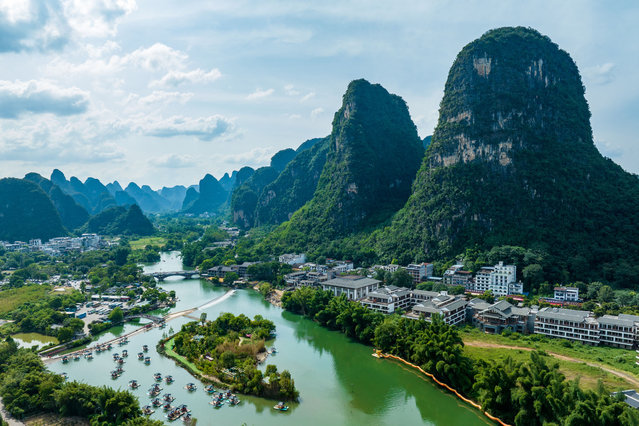 Aerial view of tourists riding bamboo rafts at Yulong River scenic area on July 14, 2024 in Guilin, Guangxi Zhuang Autonomous Region of China. (Photo by Huang Shenglin/VCG via Getty Images)