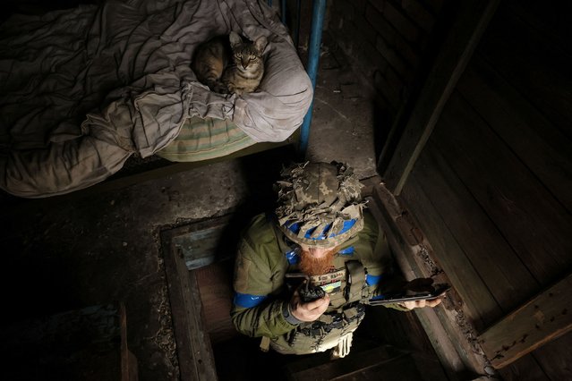 A Ukrainian serviceman talks on a radio at a front-line shelter near Chasiv Yar, Ukraine, on Tuesday, August 6, 2024. It has now been nearly two and a half years since Russia invaded Ukraine. (Photo by Oleg Petrasiuk/Press Service of the 24th King Danylo Separate Mechanized Brigade of the Ukrainian Armed Forces/Reuters)