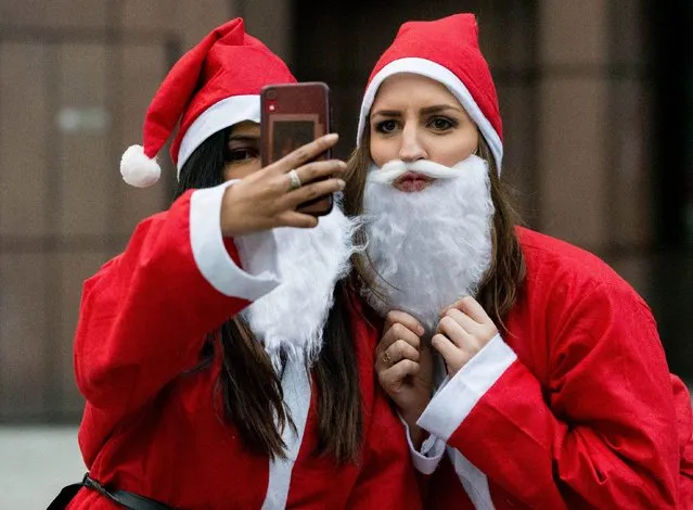 Thousands of Christmas revellers dressed up as Santa Claus and partied in the streets of London for an annual festive pub crawl yesterday,  December 14, 2019. Boozy Brits donned their Father Christmas outfits and hit the capital's bars for Santacon, which takes place on a Saturday every December. (Photo by Martyn Wheatley/i-Images)