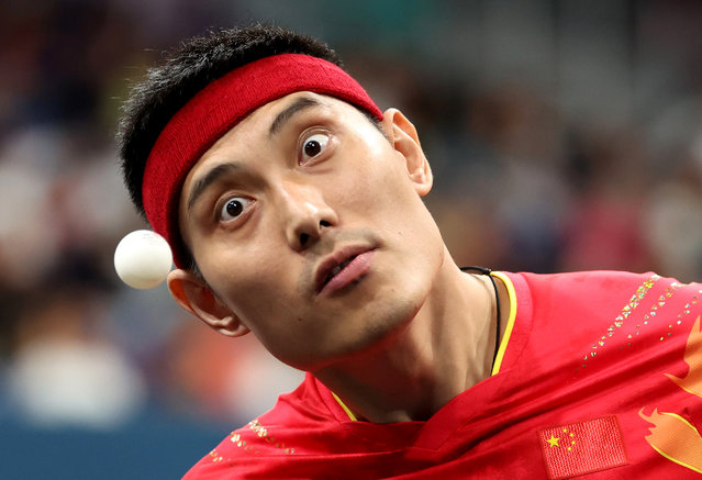 Panfeng Feng of Team People’s Republic of China competes against Valentin Baus and Thomas Schmidberger of Team Germany (not pictured) during the Men's Doubles MD8 Gold Medal Match Game 15 on day three of the Paris 2024 Summer Paralympic Games at South Paris Arena on August 31, 2024 in Paris, France. (Photo by Michael Reaves/Getty Images)