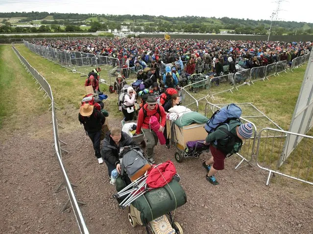 People arrive for the Glastonbury Festival. (Photo by Yui Mok/PA Wire)