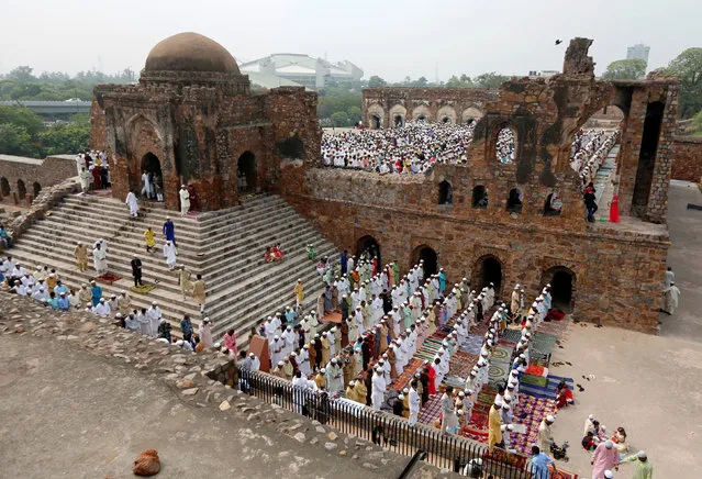 Muslims offer Eid al-Fitr prayers at the ruins of Feroz Shah Kotla mosque in New Delhi, India June 26, 2017. (Photo by Adnan Abidi/Reuters)