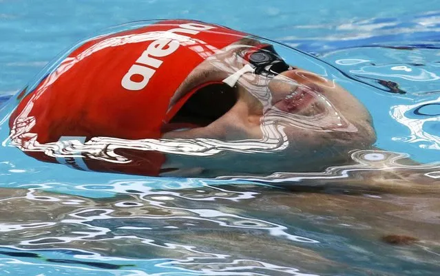 Russia's Grigory Tarasevich starts in the men's 200m backstroke heat at the Aquatics World Championships in Kazan, Russia, August 6, 2015. (Photo by Stefan Wermuth/Reuters)