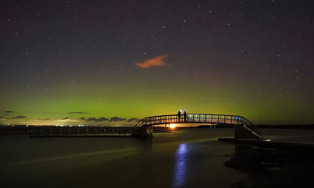 The Northern lights on view over Belhaven bridge in Dunbar Scotland overnight and into the early hours of Sunday, October 31, 2021. (Photo by Owen Humphreys/PA Images via Getty Images)