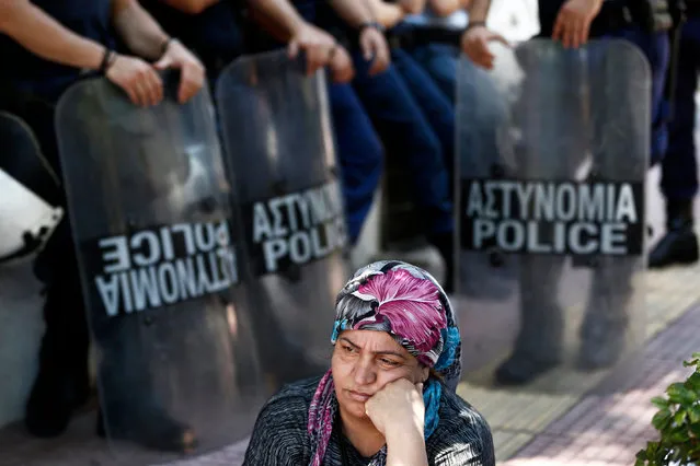 Syrian refugees living in Greece take part in a protest outside German embassy in Athens, Greece, 19 July 2017. The protests were heald against Germany's decision to limit the number of family reunifications from Greece with relatives living as refugees or asylum-seekers in Germany. (Photo by Yannis Kolesidis/EPA)