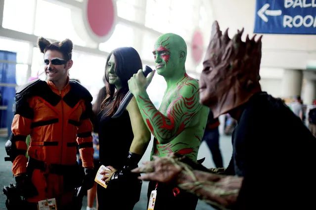 Costumed attendees dressed as characters from Guardians of the Galaxy are seen during the 2014 Comic-Con International Convention in San Diego, California July 24, 2014. (Photo by Sandy Huffaker/Reuters)