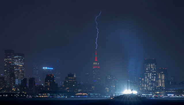 Lightning strikes the Empire State Building in New York City during a thunderstorm on May 29, 2024, as seen from Hoboken, New Jersey. (Photo by Gary Hershorn/Getty Images)