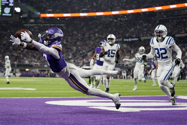 Minnesota Vikings wide receiver Jordan Addison (3) catches a 4-yard touchdown pass ahead of Indianapolis Colts safety Julian Blackmon (32) during the second half of an NFL football game, Sunday, November 3, 2024, in Minneapolis. (Photo by Abbie Parr/AP Photo)