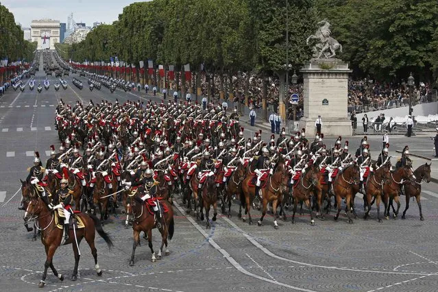 French troops of the Republican Guard (Gardes Republicain) on horseback attend the Bastille Day military parade on the Champs Elysees in Paris, France, July 14, 2016. (Photo by Benoit Tessier/Reuters)