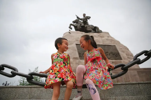 Girls play in central Ulaanbaatar, Mongolia, July 13, 2016. (Photo by Damir Sagolj/Reuters)
