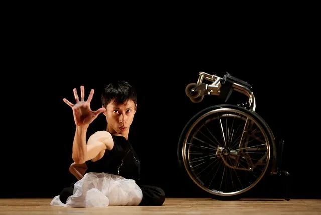 Kenta Kambara, 34, performs onstage during “Challenge & Move” a dance event in Tokyo, Japan, February 8, 2020. Kambara who was born with spina bifida, a disorder that paralysed his lower body, aims to perform at the Tokyo 2020 Paralympics opening or closing ceremonies. “If you can't walk with your legs, it's okay to walk with your hands. If there is something you want to do but cannot, it's okay to find another way”, he said. (Photo by Kim Kyung-Hoon/Reuters)