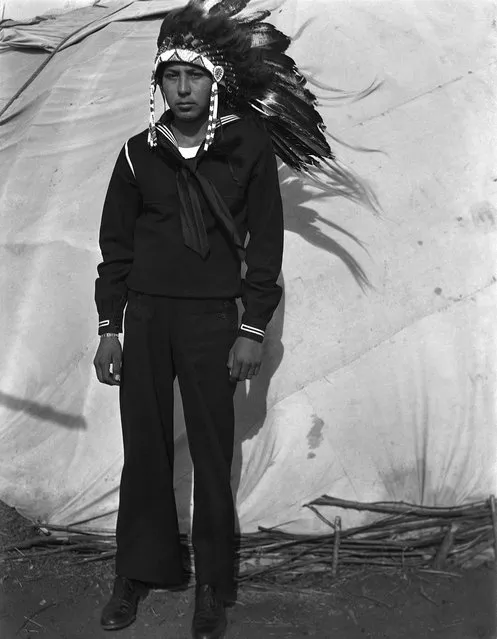 Jerry Poolaw (Kiowa), on leave from duty in the Navy. Anadarko, Oklahoma, ca. 1944. (Photo and caption by 2014 Estate of Horace Poolaw)