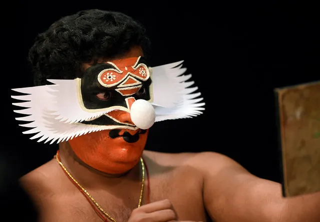 A member of the Indian company Margi Kathakali theatre applies makeup before their “Kijote Kathakali” performance, a Kathakali recital based on the Spanish classic “Don Quixote”, at the Niemeyer Center in Aviles, northern Spain, July 29, 2016. (Photo by Eloy Alonso/Reuters)
