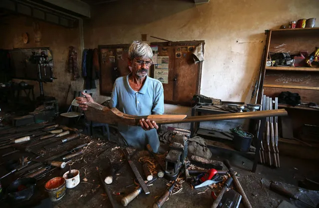 A gunsmith works inside the Zaroo Gun Factory in Bandook Khar Mohalla, downtown Srinagar, the summer capital of Indian Kashmir, 01 September 2015. According to local reports, the once thriving gunsmith industry in Kashmir has seen decline in recent years, leaving only workshops remaing. (Photo by Farooq Khan/EPA)