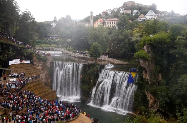 A competitor takes part in the annual international waterfall jumping competition held in the old town of Jajce, Bosnia and Herzegovina, August 6, 2016. (Photo by Dado Ruvic/Reuters)