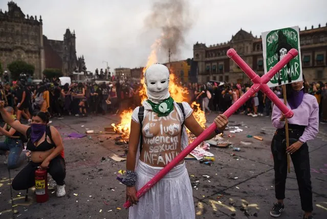 A woman poses for a photo while taking part in a protest during the International Women's Day, in Mexico City, on March 8, 2020. Women around the globe are taking action to mark International Women's Day and to push for action to obtain equality. (Photo by Victoria Razo/AFP Photo)