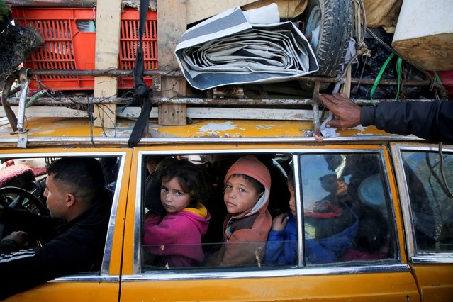 Palestinians, who were displaced to the south at Israel's order during the war, wait to head back to their homes in northern Gaza by vehicle through Salahudeen Road, amid a ceasefire between Israel and Hamas, in the central Gaza Strip, on January 27, 2025. (Photo by Hatem Khaled/Reuters)