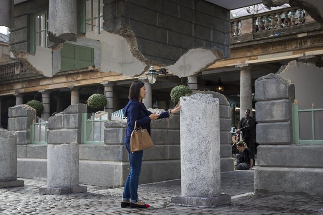 An installation entitled “Take my lightning but don't steal my thunder” by British artist Alex Chinneck stands in Covent Garden on October 2, 2014 in London, England. (Photo by Rob Stothard/Getty Images)