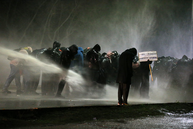 Turkish anti-riot police use water canon as they clash with Middle East Technical University (ODTU) students protesting against the arrest of Istanbul's mayor, in Ankara on March 20, 2025. Turkish police detained Istanbul's powerful Mayor Ekrem Imamoglu on March 19, in connection with two investigations into graft and “supporting terror”, a move that the main opposition party slammed as a politically-motivated "coup". (Photo by Adem Altan/AFP Photo)