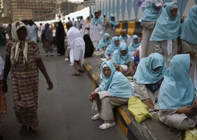 Muslim pilgrims wait for Friday prayers to start in the holy city of Mecca ahead of the annual haj pilgrimage, September 18, 2015. (Photo by Ahmad Masood/Reuters)