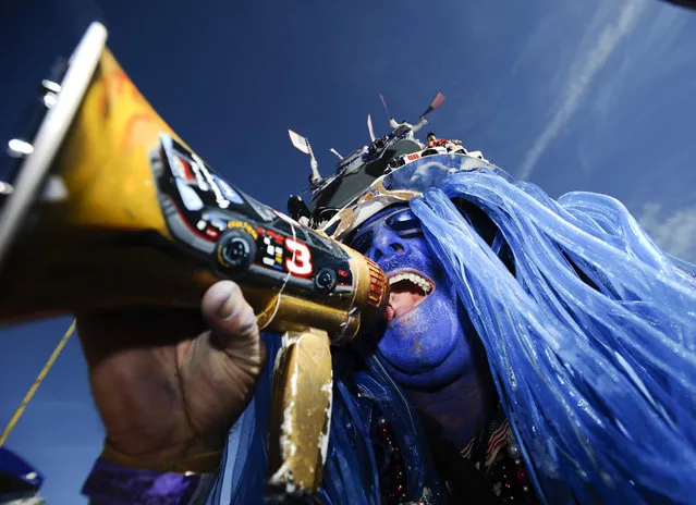 NASCAR fan Anthony Wright, of Egg Habor Township, N.J., cheers before the NASCAR Sprint Cup Series auto race at Talladega Superspeedway, Sunday, October 19, 2014, in Talladega, Ala. (Photo by Rainier Ehrhardt/AP Photo)