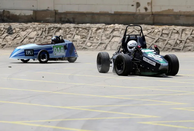 Egyptian university students drive the cars their teams built to compete at the Formula Student UK for the first car and for Global Hybrid-Electric Challenge for the second car in Cairo, Egypt September 2, 2016. (Photo by Mohamed Abd El Ghany/Reuters)