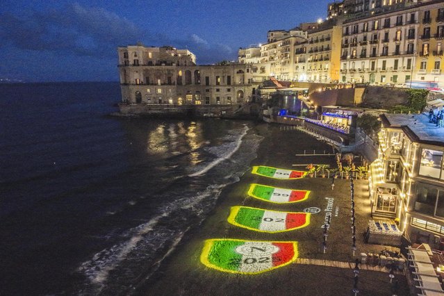 Four luminous shields are projected on the Posillipo beach depicting SSC Napoli's four league titles after they won the 2024/2025 Serie A title, in Napels, Italy, 23 May 2025. SSC Napoli won their fourth league title. (Photo by EPA/EFE/Stringer)