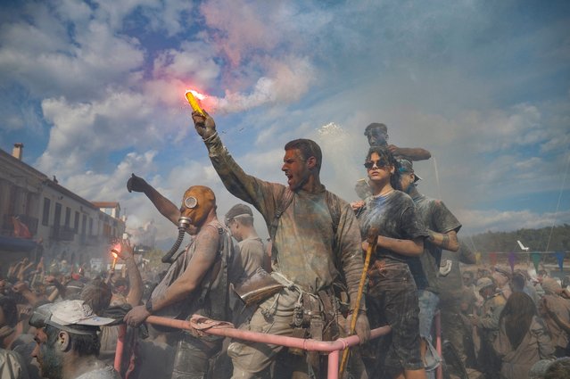 Revellers participate in a colourful “flour war”, celebrating the “Ash Monday” or “Clean Monday”, a traditional festivity marking the end of the carnival season and the start of the 40-day Lent period until the Orthodox Easter, in the town of Galaxidi, Greece, on March 18, 2024. (Photo by Louisa Gouliamaki/Reuters)