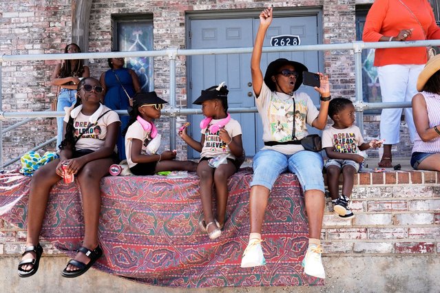 People cheer during a Juneteenth parade Thursday, June 19, 2025, in Galveston, Texas. (Photo by David J. Phillip/AP Photo)