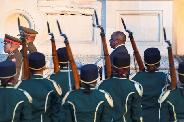 South African President Cyril Ramaphosa walks past the guard of honour upon his arrival for the 2023 state-of-the-nation address (SONA) at the Cape Town City Hall in Cape Town on February 9, 2023. (Photo by Rodger Bosch/Pool via AFP Photo)
