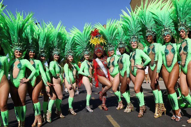Revellers pose for a photo, as they take part in the Notting Hill Carnival, in London, Britain, on August 25, 2025. (Photo by Jack Taylor/Reuters)