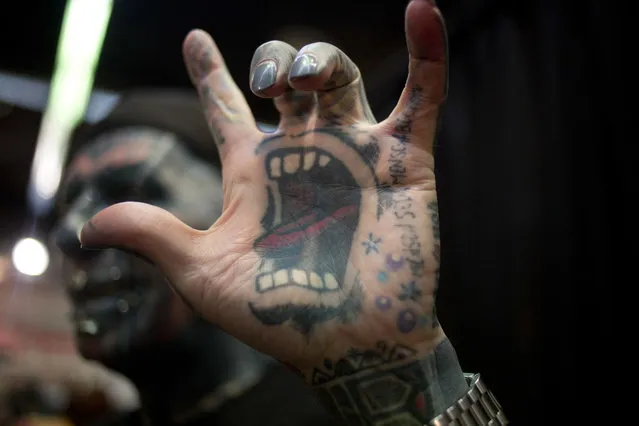 Magneto of Berlin Germany shows his tattoos for a photograph during the Israel Tattoo Convention in Tel Aviv, Israel, Friday, October 7, 2016. Around 140 tattoo artists from Israel and other countries participated in a 2 day fair in Tel Aviv. (Photo by Ariel Schalit/AP Photo)