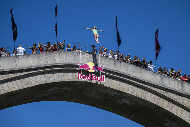 In this handout image provided by Red Bull, Kaylea Arnett of the USA dives from the 21 metre Stari Most (Old Bridge) during the first competition day of the third stop of the Red Bull Cliff Diving World Series on September 04, 2025 at Mostar, Bosnia and Herzegovina. (Photo by Romina Amato/Red Bull via Getty Images)