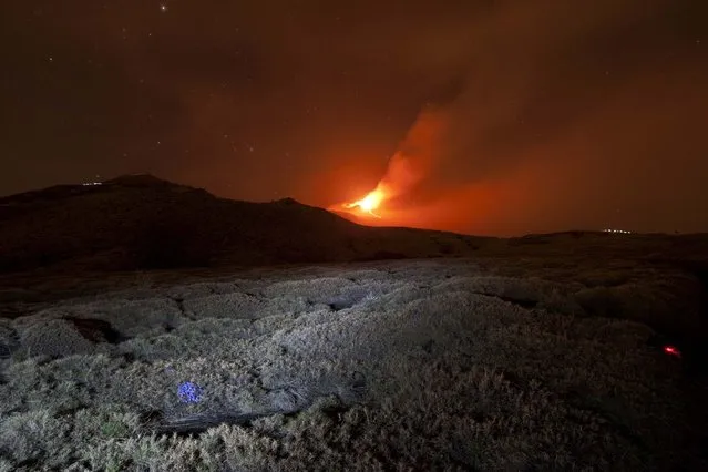 Italy's volcanic Mount Etna spews lava during an eruption on the southern Italian island of Sicily April 11, 2013. Mount Etna is Europe's tallest and most active volcano. Picture taken April 11, 2013. (Photo by Antonio Parrinello/Reuters)