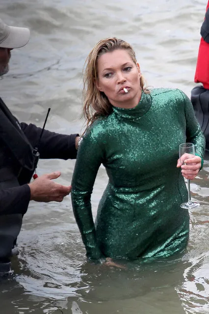 Model Kate Moss gets a helping hand when she films her cameo appearance for ‘Absolutely Fabulous: The Movie’ in London, United Kingdom on November 5, 2015. She emerges from the River Thames with a lit cigarette and a designer Jean Paul Gaultier dress. (Photo by Dean Paul/Eagle Eyes/FameFlynet)