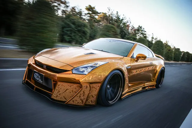 This is the ultimate accessory for bling lovers – a supercar covered in gold plating. Japanese designers covered the Nissan R35 GT-R in fibre glass body kit panels covered with a layer of 24 carat spray. Master engraver Takahiko Izawa even spent weeks carving intricate oriental patterns into the shiny new surface on the 820 horsepower beast. But so far the luxury set of wheels – dubbed “Godzilla” with its $1m price tag – has failed to attract a buyer, despite being unveiled in super-rich car-mad city Dubai. (Photo by SWNS.com)