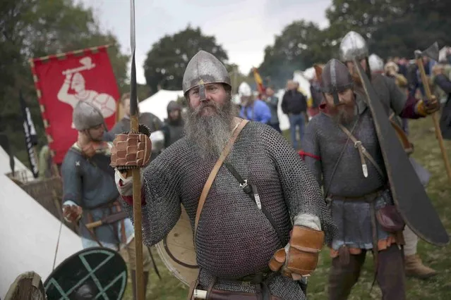 Re-enactors dress in historical costume as part of the Battle of Hastings anniversary commemoration events in Battle, Britain October 15, 2016. (Photo by Neil Hall/Reuters)