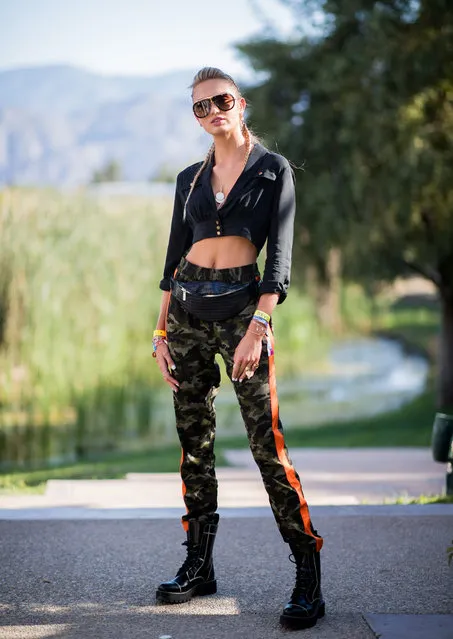 Model Romee Strijd wearing cropped top, military pants, boots, sunglasses is seen at Revolve Festival on April 14, 2018 in Indio, California. (Photo by Christian Vierig/GC Images)