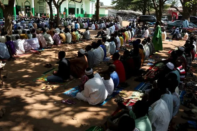 Men conduct Friday prayers by the central mosque of the mostly Muslim PK 5 neighbourhood, where Pope Francis will visit, Bangui, Central African Republic, November 27, 2015. (Photo by Siegfried Modola/Reuters)