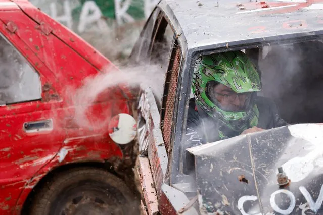 A driver reacts as his car is struck by another vehicle in a mini car demolition derby organised by the Cars and Motorcycles Sport Association (Malta) in Ta' Qali, Malta on May 7, 2023. (Photo by Darrin Zammit Lupi/Reuters)