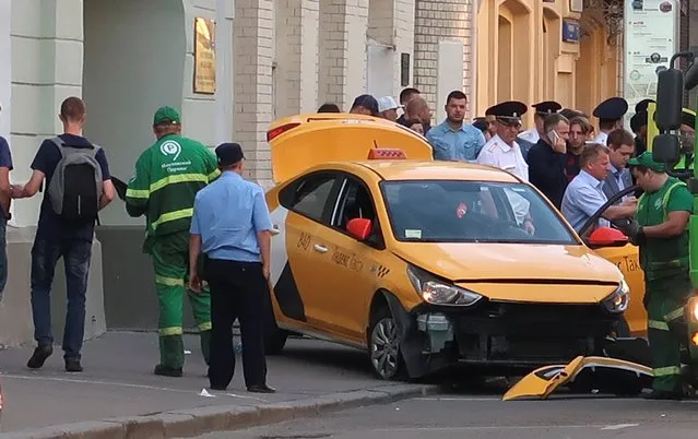 A view shows a damaged taxi, which ran into a crowd of people, in central Moscow, Russia June 16, 2018. The driver, identified by Moscow city authorities as a national of the central Asian republic of Kyrgyzstan, was taken into custody for questioning. The incident occurred on the third day of the Russia World Cup, with Moscow packed with foreign tourists who snap pictures of the Kremlin and Red Square. (Photo by Reuters/Staff)