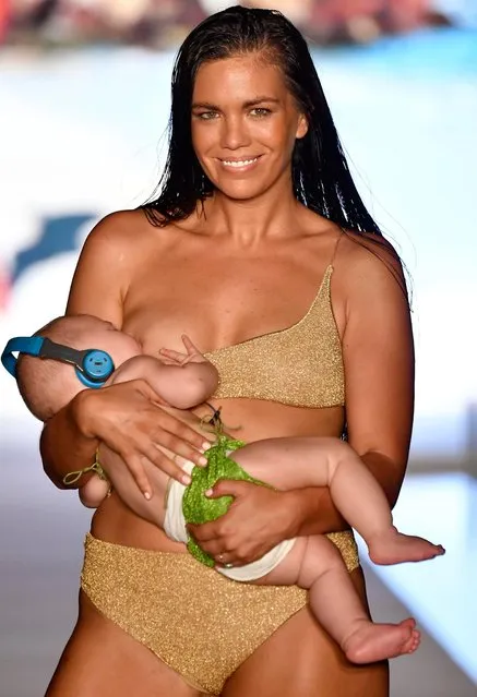 Sports Illustrated model Mara Martin breastfeeds while walking the runway for the 2018 Sports Illustrated Swimsuit show at PARAISO during Miami Swim Week at The W Hotel South Beach on July 15, 2018 in Miami, Florida. (Photo by Frazer Harrison/Getty Images for Sports Illustrated)