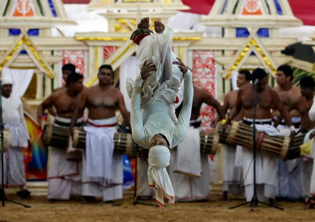 A traditional dancer performs during a Gara demon ceremony in Colombo, Sri Lanka November 25, 2016. (Photo by Dinuka Liyanawatte/Reuters)