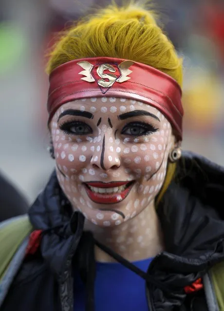 A woman dressed in a costume of Superwoman poses at “Weiberfastnacht” (Women's Carnival) in Cologne February 12, 2015. (Photo by Ina Fassbender/Reuters)