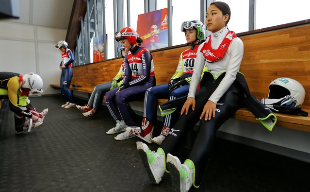 Sara Takanashi of Japan, Maja Vtic from Slovenia and Germany's Carina Vogt (R-L) prepare for a training session of the women's Individual normal hill HS100 ski jumping at the Nordic World Ski Championships in Falun February 18, 2015. (Photo by Kai Pfaffenbach/Reuters)