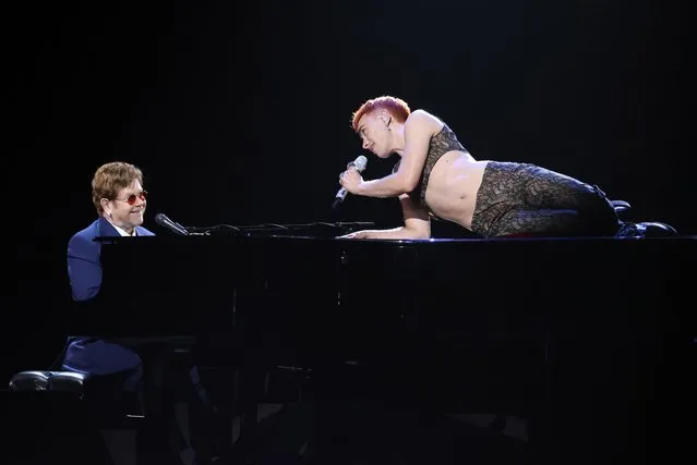A handout photo made available by the Brit Awards shows Elton John (L) and Olly Alexander performing at the Brit Awards 2021 at the O2 Arena in Greenwich, Greater London, Britain, 11 May 2021. It is the 41st edition of the British Phonographic Industry's annual pop music awards. (Photo by John Marshall/EPA/EFE)