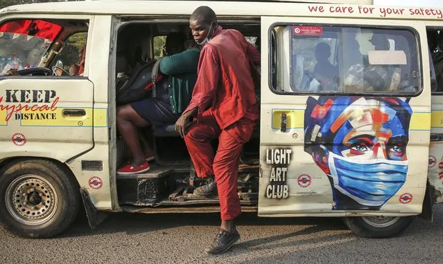 A matatu, or public minibus, displays an informational painting instructing people to wear masks to curb the spread of the coronavirus, in the low-income Kibera neighborhood of Nairobi, Kenya, Saturday, June 12, 2021. Africa has recorded more than 5 million confirmed COVID-19 cases, including 135,000 deaths. That is a small fraction of the world's caseload, but many fear the crisis could get much worse. ​(Photo by Brian Inganga/AP Photo)
