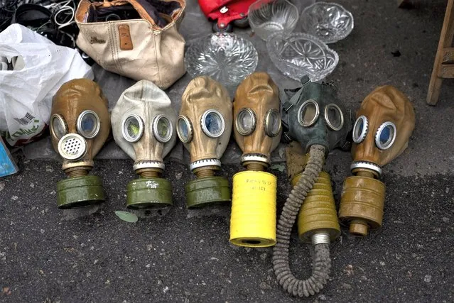 Soviet-era gas masks are for sale at a flea market in Kyiv, Ukraine, Saturday, July 8, 2023. (Photo by Jae C. Hong/AP Photo)