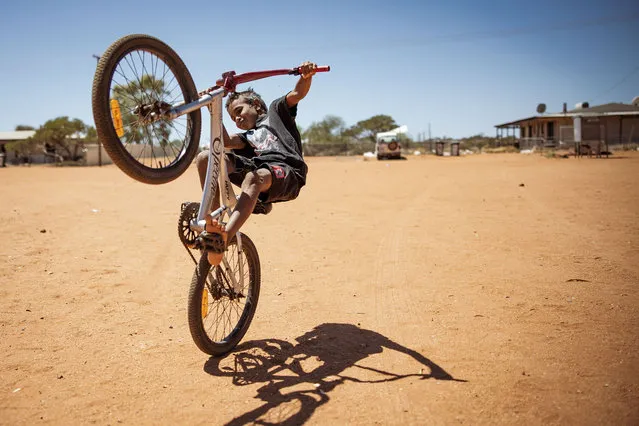 A young child does a Wheelie on his bicycle on October 04, 2023 in Pia Wadjarri, Australia. A referendum for Australians to decide on an indigenous voice to parliament will be held on October 14, 2023 and compels all Australians to vote by law. Early voting began on Oct. 2, with voting getting underway in rural and regional Australia as well. (Photo by Tamati Smith/Getty Images)