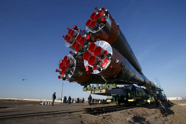 The Soyuz TMA-16M spacecraft is transported to its launch pad at the Baikonur cosmodrome March 25, 2015. The Soyuz is scheduled to blast off from Kazakhstan on March 28, with Russian cosmonauts Mikhail Kornienko, Gennady Padalka and NASA astronaut Scott Kelly to the International Space Station. (Photo by Maxim Zmeyev/Reuters)